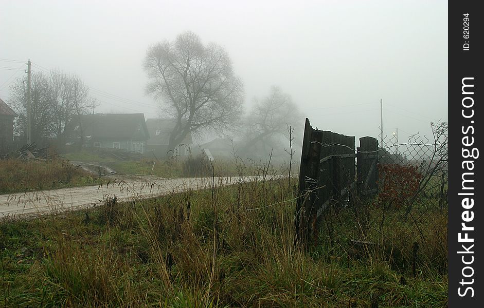 The image of a village in a fog. The image of a village in a fog