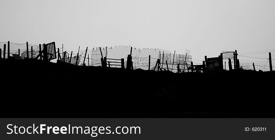 Makeshift fences and gates on a hilltop in South Wales, UK. Makeshift fences and gates on a hilltop in South Wales, UK.