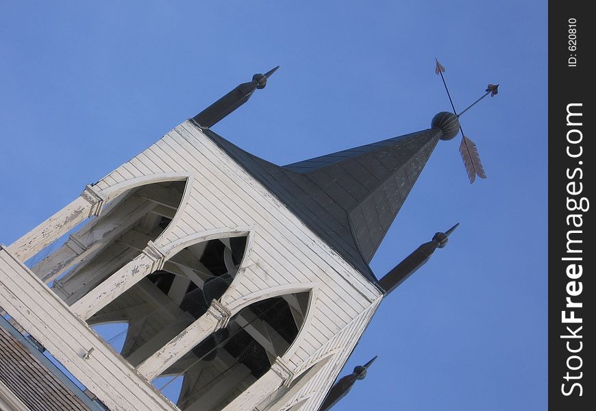 This image depicts the steeple of a church. This image depicts the steeple of a church.