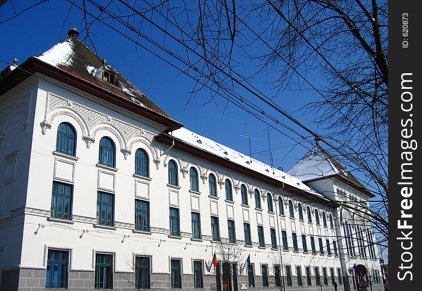 The construction of this building (which for a time functioned as the Commercial High School) began in 1914 but was completed only after the war, between 1924 and 1929. The architectural style is composed of wide eaves, an observation tower and cornices with designs reflecting Romanian folklore. The construction of this building (which for a time functioned as the Commercial High School) began in 1914 but was completed only after the war, between 1924 and 1929. The architectural style is composed of wide eaves, an observation tower and cornices with designs reflecting Romanian folklore.