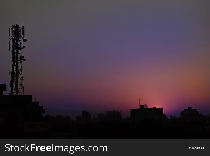Sunsets and sunrise hues in skies over modern cities India. Sunsets and sunrise hues in skies over modern cities India