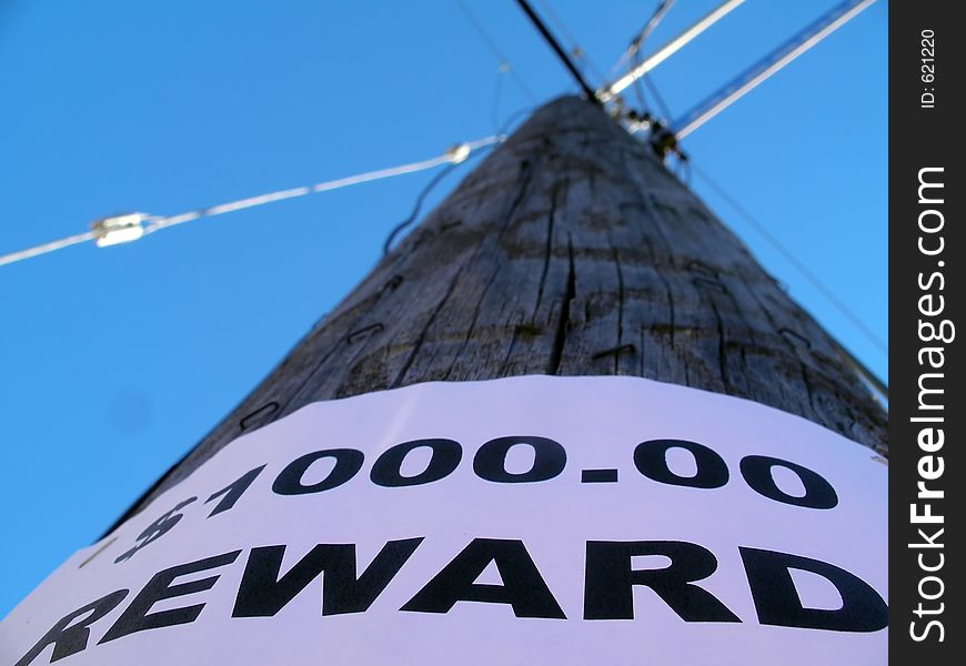 Shallow depth of field. focus on the lettering. pole goes out of focus pointing towards the sky and meeting with it's supporting lines. Shallow depth of field. focus on the lettering. pole goes out of focus pointing towards the sky and meeting with it's supporting lines.