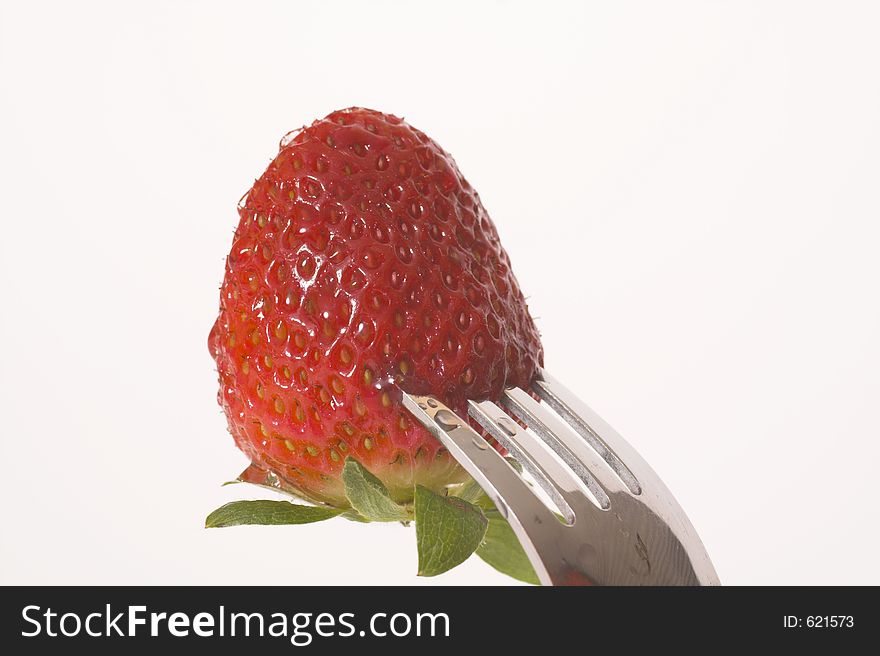 Strawberry on fork