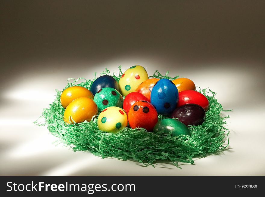 Coloured easter eggs in green grass