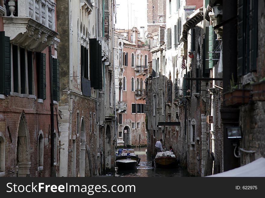 The small canals of venice are typical for this city. The small canals of venice are typical for this city
