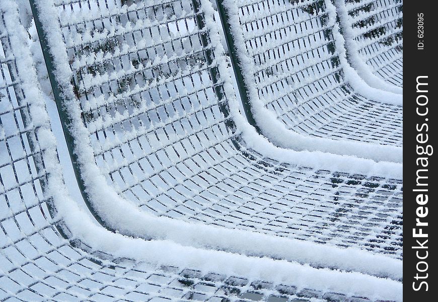 Bench covered with snow