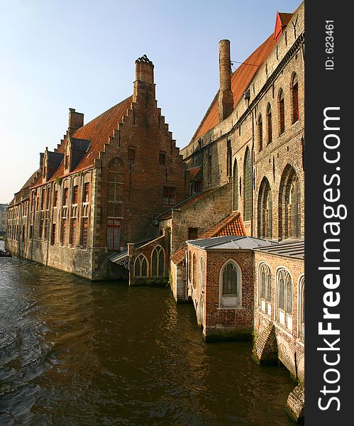 Historic brick buildings line the canal in Brugge, Belgium. Historic brick buildings line the canal in Brugge, Belgium