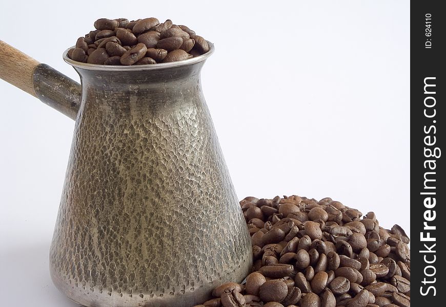Cezve and coffee beans. Cezve and coffee beans