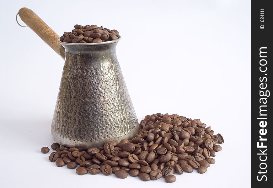 Cezve and coffee beans. Cezve and coffee beans