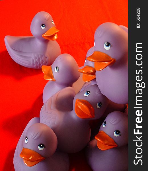 Purple rubber duckies in a pile. Purple rubber duckies in a pile.