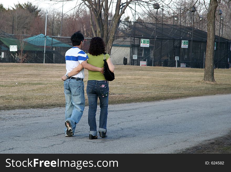 Couple holding each other while walking. Couple holding each other while walking