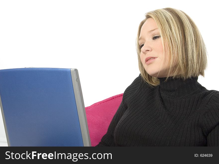 Beautiful young blonde woman working with laptop. Shot in studio. Beautiful young blonde woman working with laptop. Shot in studio.