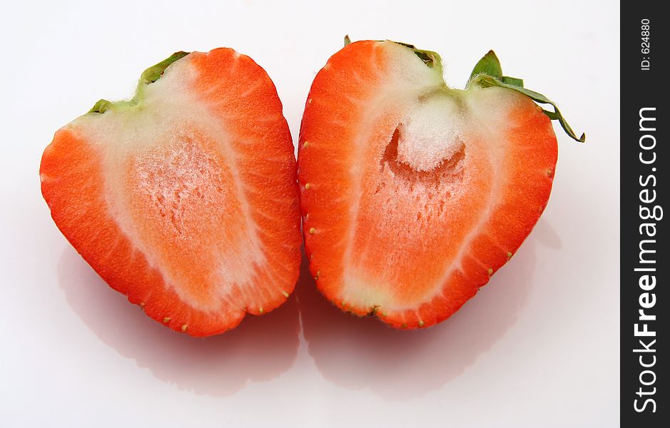 Strawberry cut in half on white background. Strawberry cut in half on white background