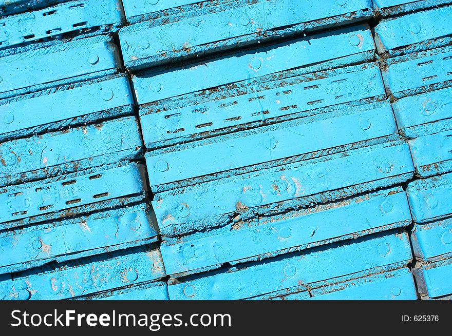 Abstract pattern of blue painted plank ends. Abstract pattern of blue painted plank ends.