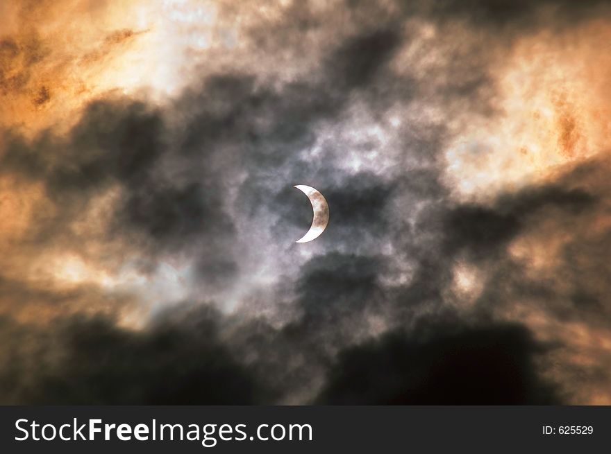 Eclipse seen through the clouds. Shot in Bucharest, Romania, March 29,2006.