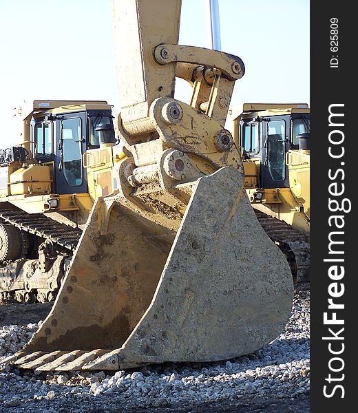 Large backhoe bucket at a construction site.