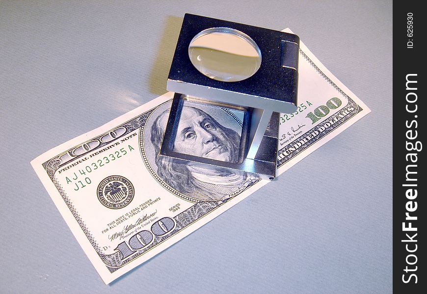 American Money and Magnifying Glass