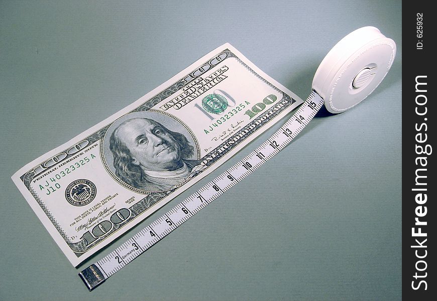 American Money, 100 Dollar bill and measuring tape