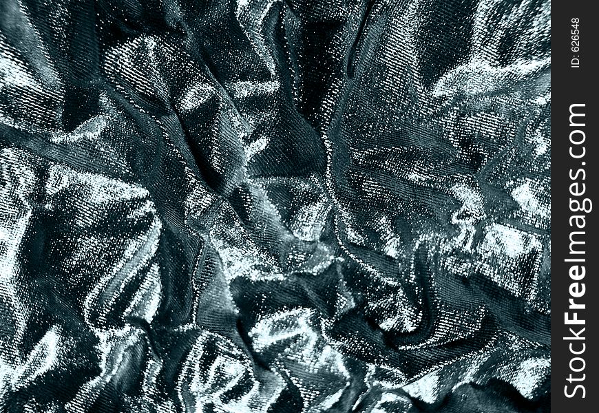Close-up of silver tissue for an abstract background. Close-up of silver tissue for an abstract background.
