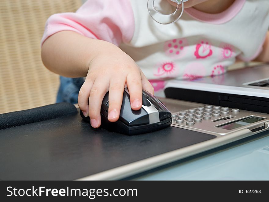 Little baby working on notebook. Little baby working on notebook