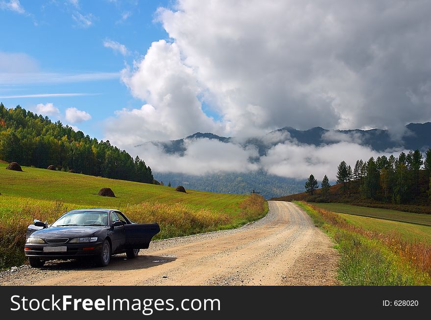 Car, Road And Skies.