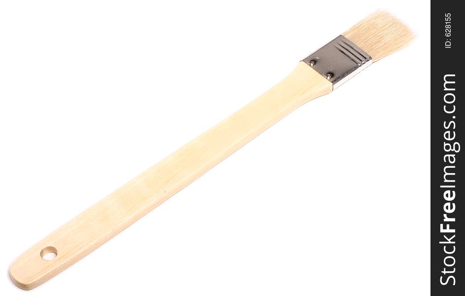 A wooden-handled wide paintbrush, isolated on white