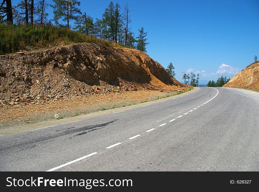 Road, mountains and skies.