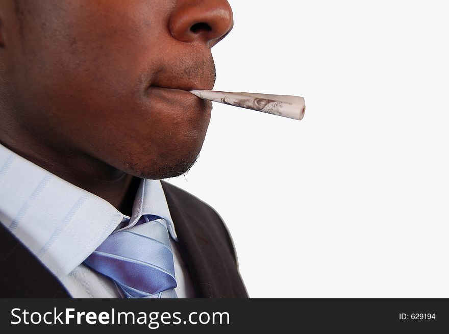 This is an image of a businessman with a 10 pound note in his lips. This is a metaphor for smoking money, wastage, business gamble etc.. (Please let me know where the image will be used by leaving a message in the Comments Section/See Portfolio)