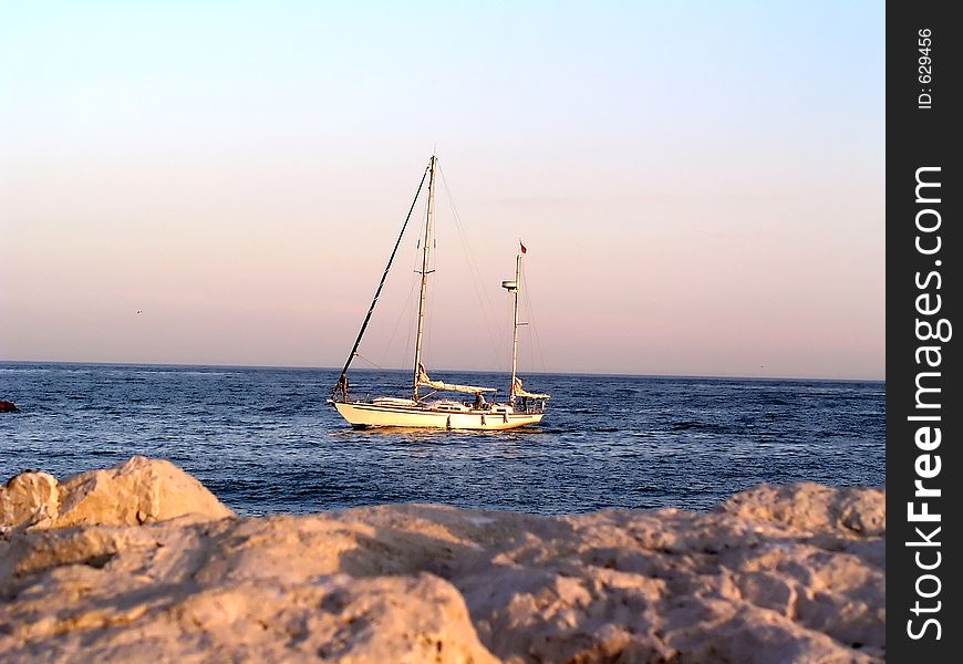 Small sailingboat at sea