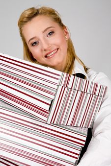 Smiling Young Woman With Stack Of Boxes Stock Image Smiling Young Woman With Stack Of Boxes Stock Image