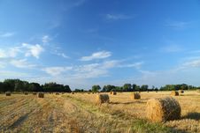 Straw Bales On Farmland With Blue Cloudy Sky Stock Images Straw Bales On Farmland With Blue Cloudy Sky Stock Images