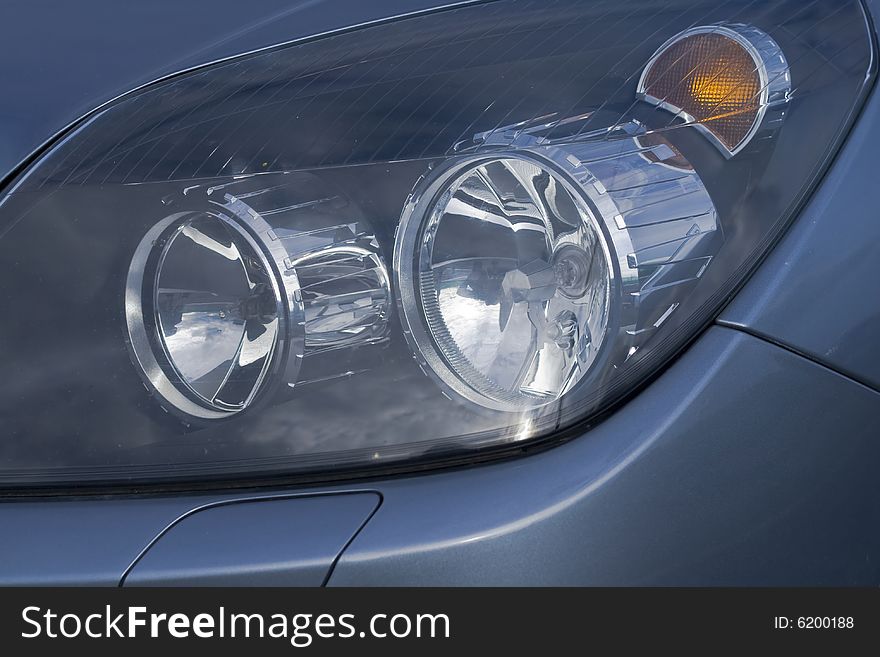 Car headlights and turning light in a close up. Car headlights and turning light in a close up