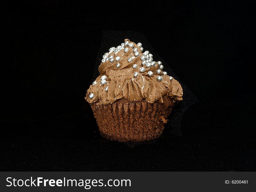 Cup cakes/Muffins suitable for a birthday card or celebration card.chocolate fondant icing and silver balls. Cup cakes/Muffins suitable for a birthday card or celebration card.chocolate fondant icing and silver balls