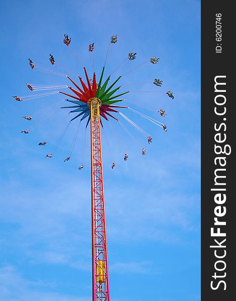 High carrousel on a blue sky