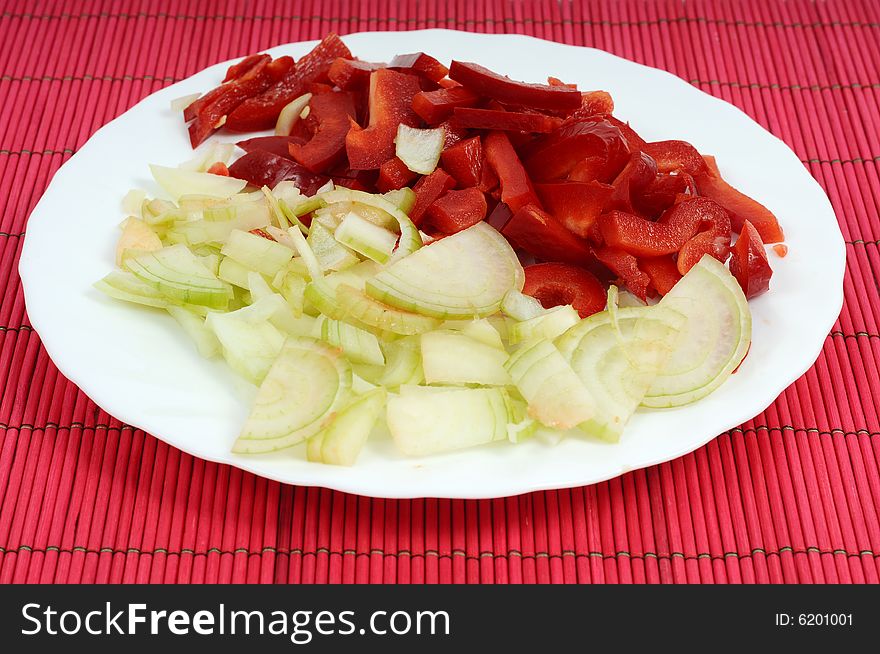 Image of slices of red pepper and onion. Image of slices of red pepper and onion