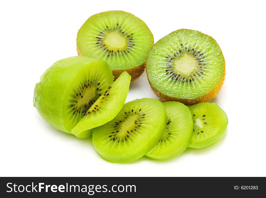 Kiwi fruit sliced into pieces on white background. Kiwi fruit sliced into pieces on white background.