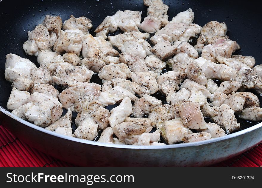 Image of chicken on frying pan