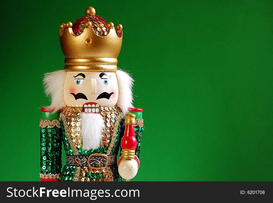 Christmas nutcracker against green background. Christmas nutcracker against green background