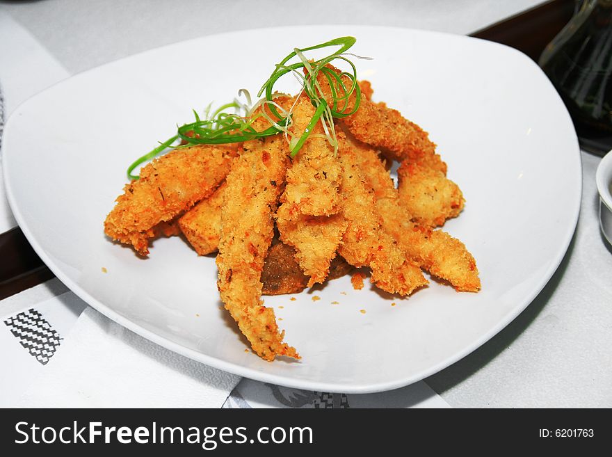 Deep fried fish fillet served in a dish