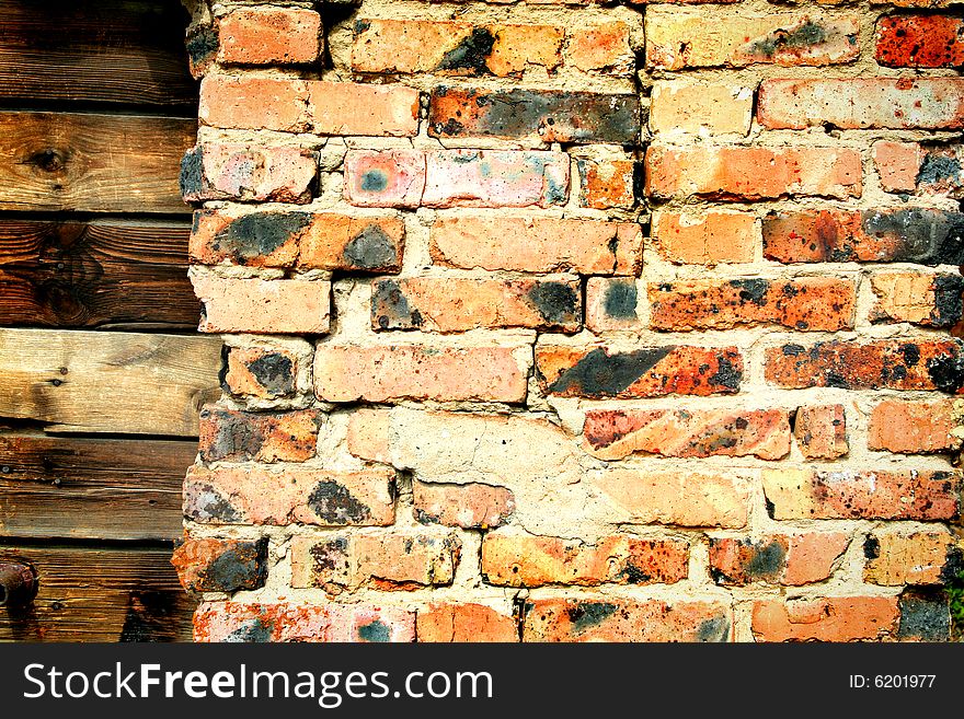 Grunge dark red brick and wood wall background texture