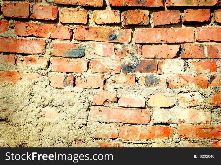 Roughly plastered brick wall, background