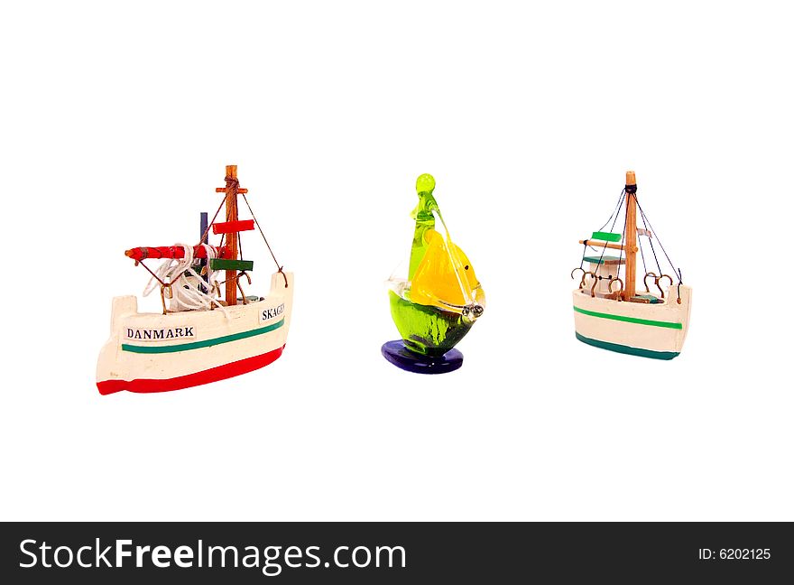 Three decorative ornamental crystal & wooden Mini Sail Ships perspective view. Three decorative ornamental crystal & wooden Mini Sail Ships perspective view