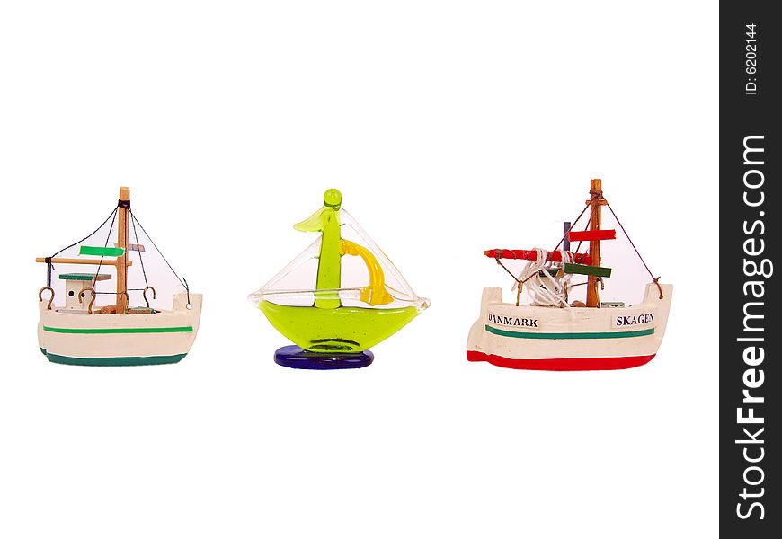 Three decorative ornamental crystal & wooden Mini Sail Ships side view. Three decorative ornamental crystal & wooden Mini Sail Ships side view