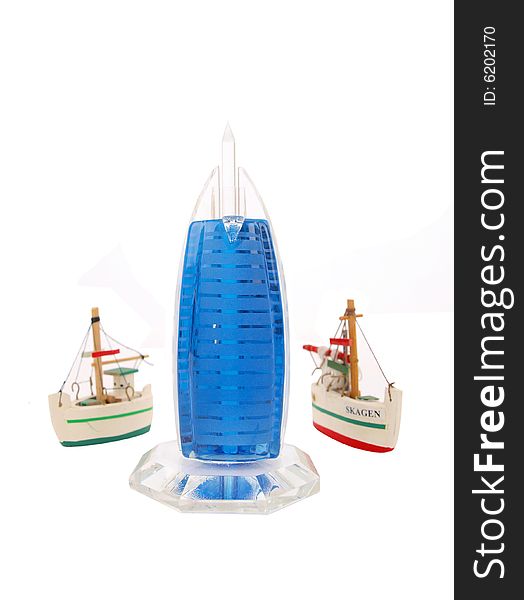 Two Mini Sail Ships flanking Alarab Burj building model. Two Mini Sail Ships flanking Alarab Burj building model