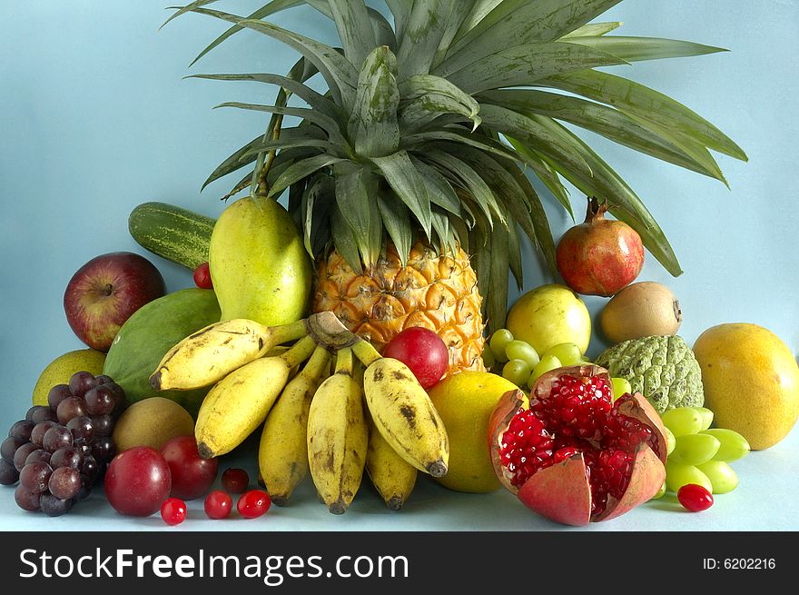 Still life with fruits on blue background.