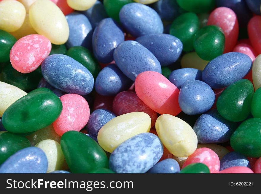 Jelly beans scattered around background.