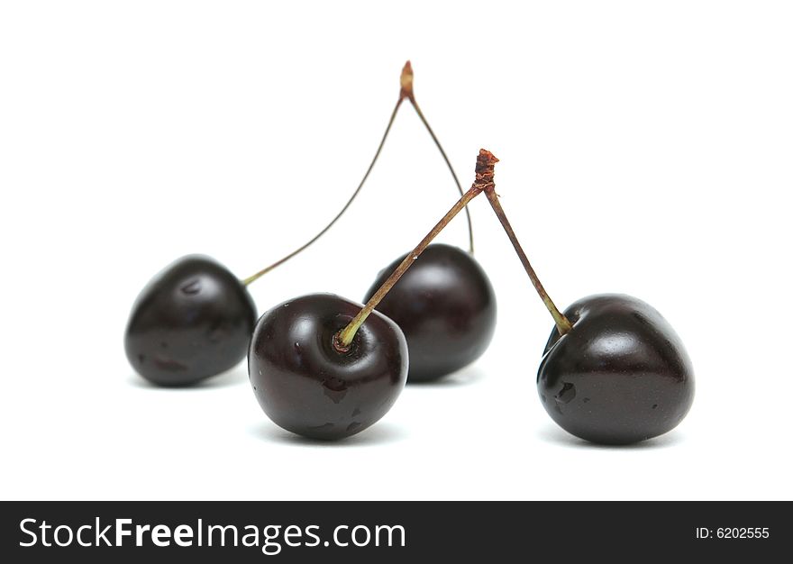Two berries of a sweet cherry on a white background