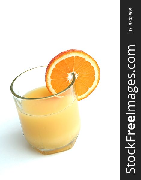 Glass Of Orange Juice And Segment Of An Orange