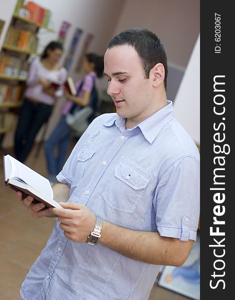 Young student holding book