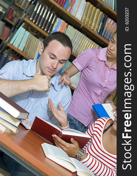 Three Students In Library